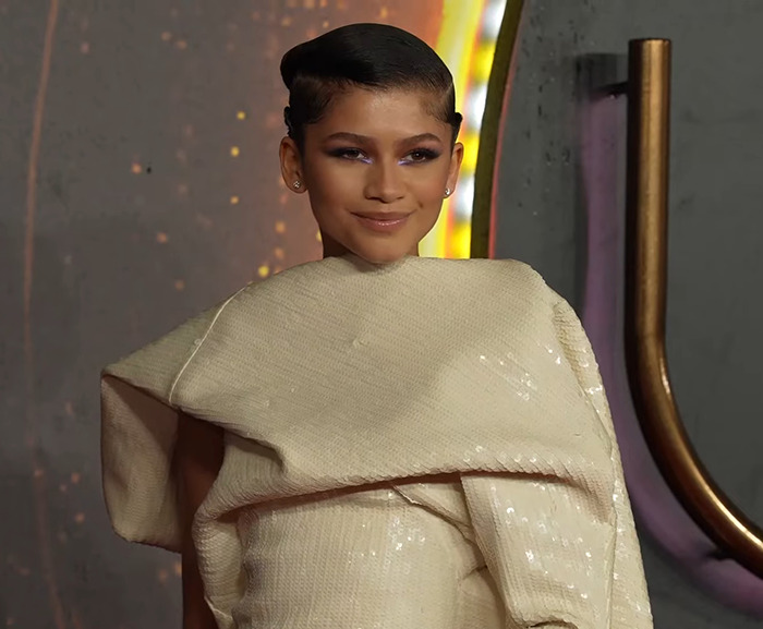 Zendaya in an elegant cream gown on the red carpet.
