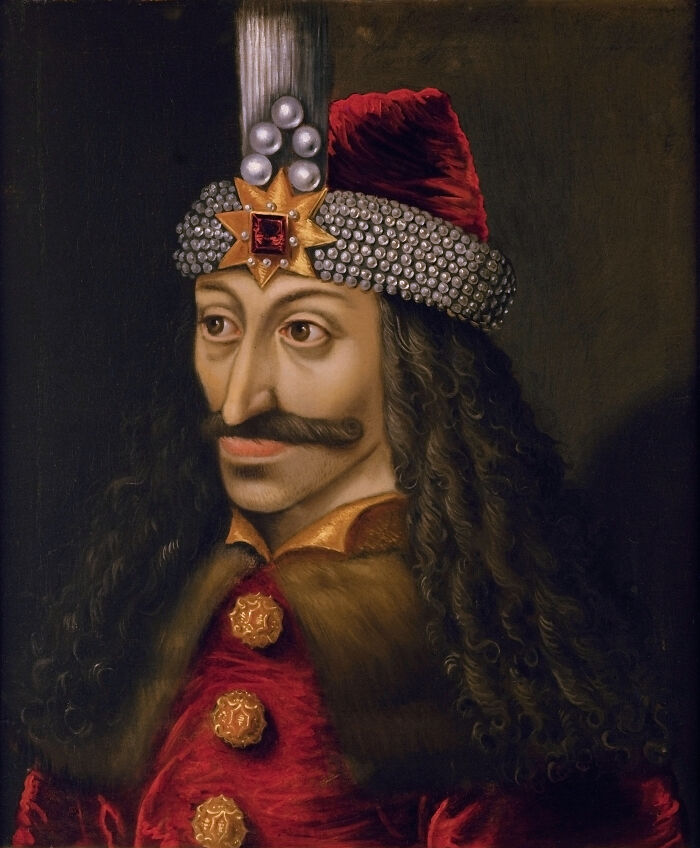 A historical painting of a royal figure with a jeweled headdress and red cloak, related to overlooked historical events.