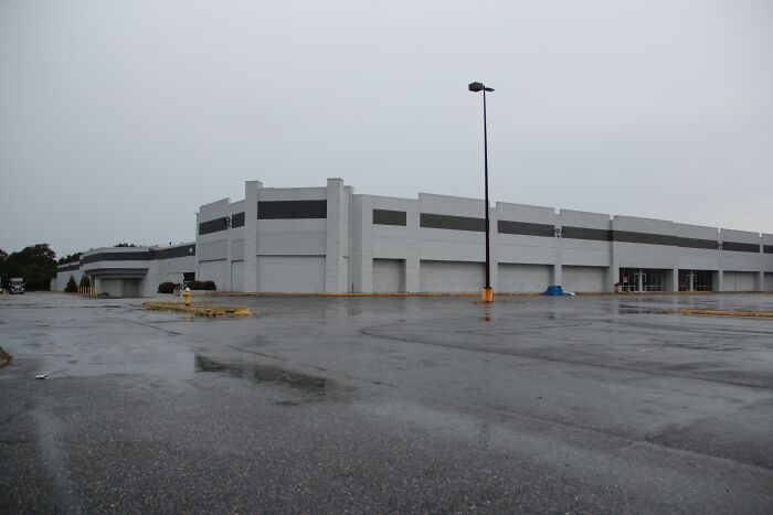 Vacant building on a rainy day, evoking weird unsolved mysteries with its deserted and mysterious atmosphere.