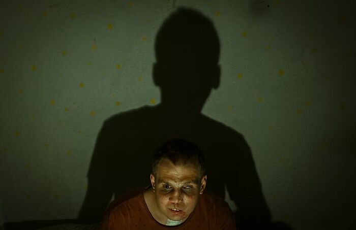Man with a shadowy backdrop, part of The Artist Gallery Awards winning photos 2024.