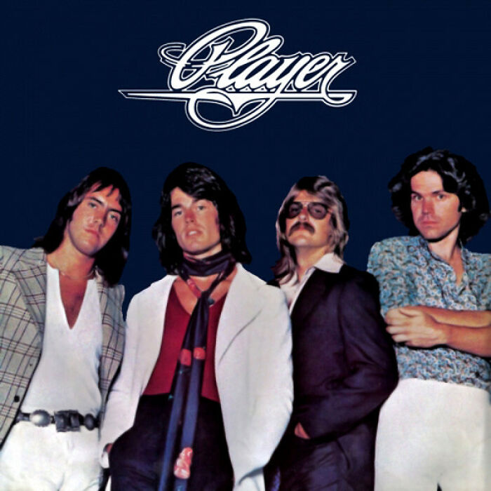 '70s band Player posing in retro fashion against a dark background.