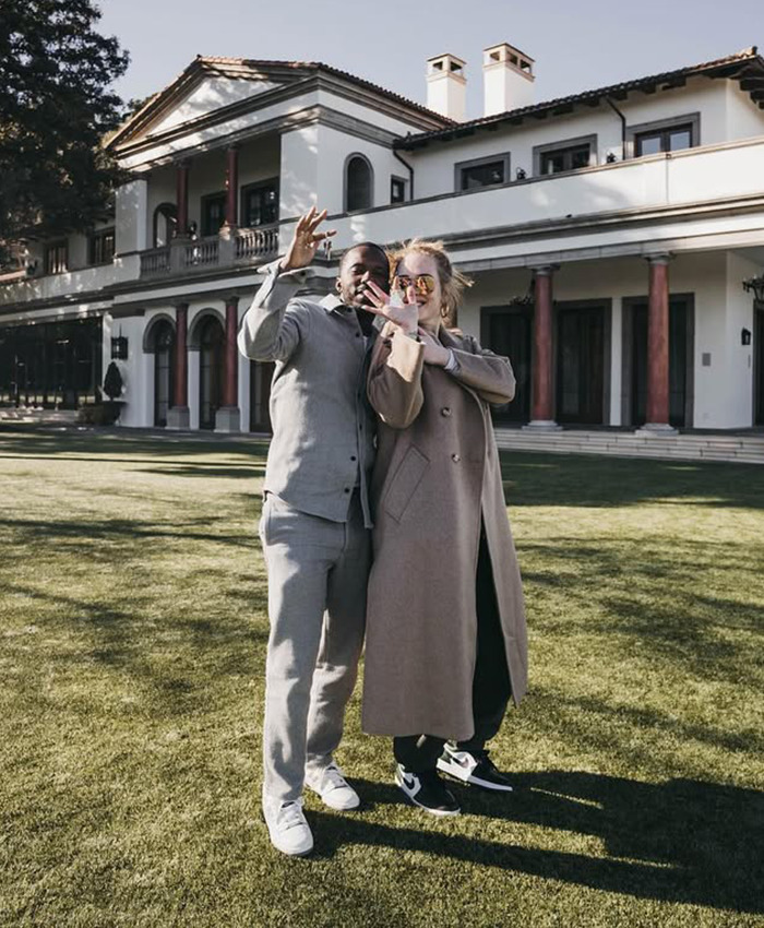 Adele with partner Rich Paul poses outdoors. Adele with partner Rich Paul poses outdoors.