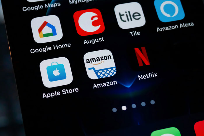 Amazon app on smartphone screen, showcasing AI revolution impact on shopping services. Amazon app on smartphone screen, showcasing AI revolution impact on shopping services.