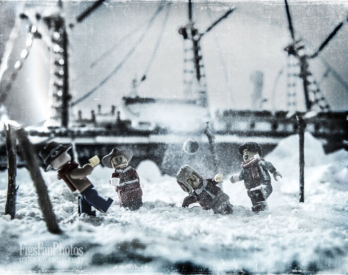 LEGO figures reenacting the Trans-Antarctic Expedition in a snowy setting with a ship in the background.