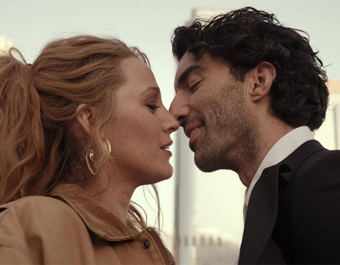Blake Lively and Justin Baldoni close together, creating a romantic moment outdoors.