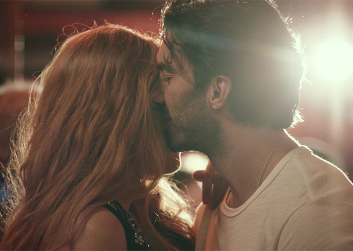 Two actors in an intimate scene under dramatic lighting, related to opinion on intimacy coordination in film. Two actors in an intimate scene under dramatic lighting, related to opinion on intimacy coordination in film.