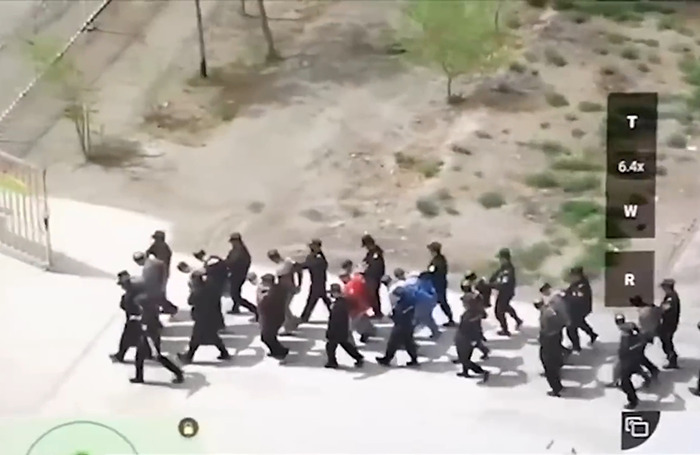 Aerial view of a group walking in formation, illustrating a Chinese-Canadian's discussion on misconceptions about China.