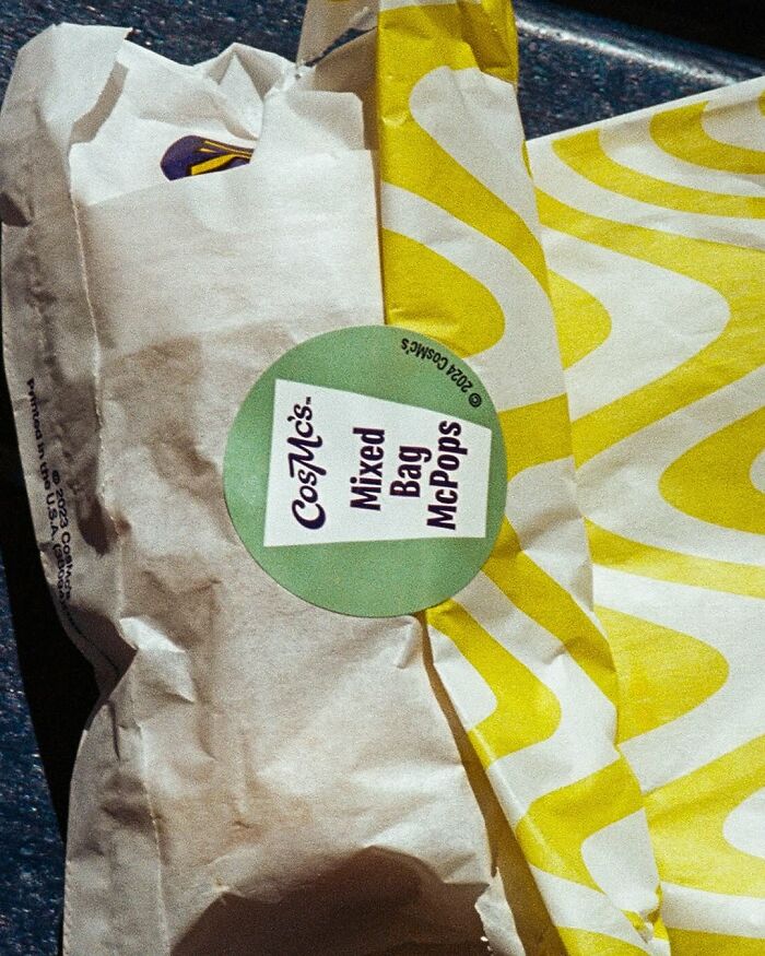 Cosmcs McDonald's packaging with a label reading "Mixed Bag McPops" on a yellow and white patterned background.