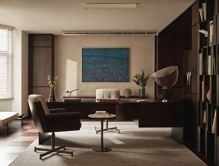 Luxurious interior design with modern furniture, stylish artwork, and elegant decor in a well-lit office setting.