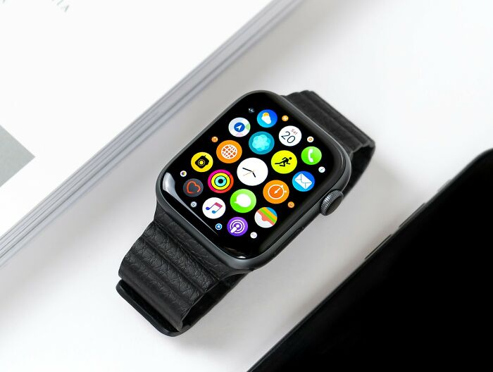 Smartwatch with app icons, representing trends folks say they'd rather avoid.