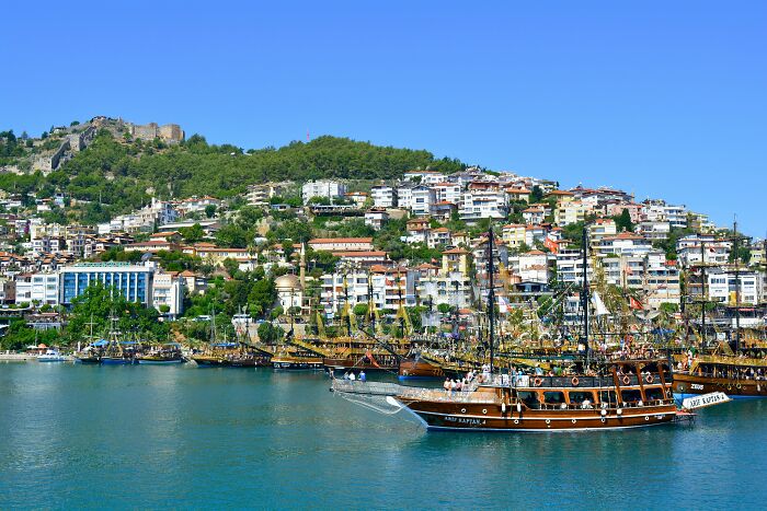 Seaside view with boats and hillside buildings in a country considered by some as the worst ever visited.