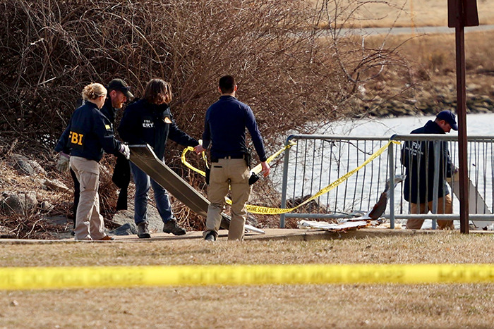 FBI agents investigate crash scene. FBI agents investigate crash scene.