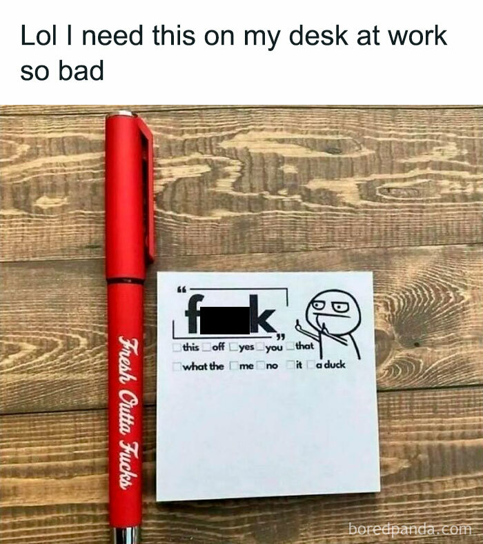 Red pen with "Fresh Outta F***s" and a humorous checklist paper on a wooden desk.