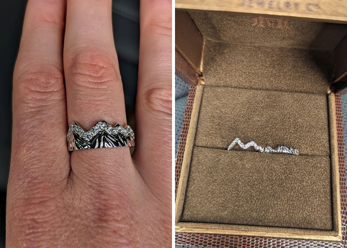 Mountain-themed ring as an anniversary surprise, displayed on a hand and in a jewelry box.