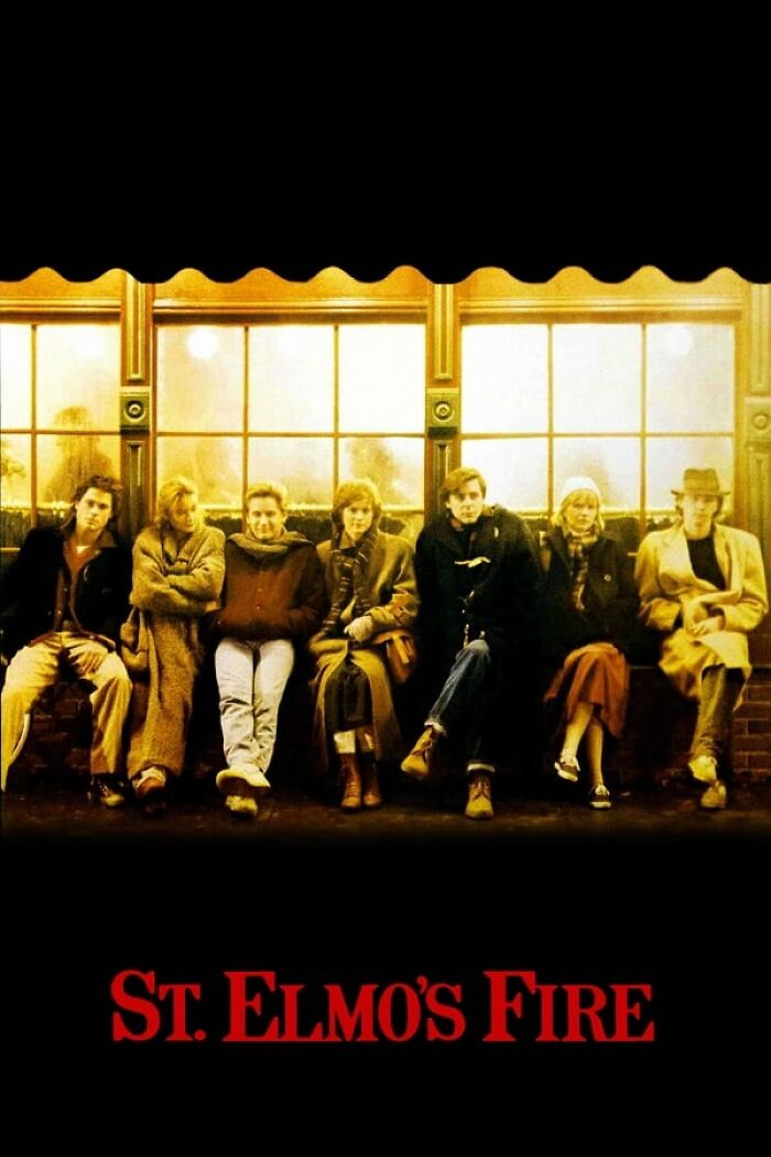 Seven friends sitting together, dressed in 80s fashion, framed by a lit window. Best-Nostalgia-Movies theme.