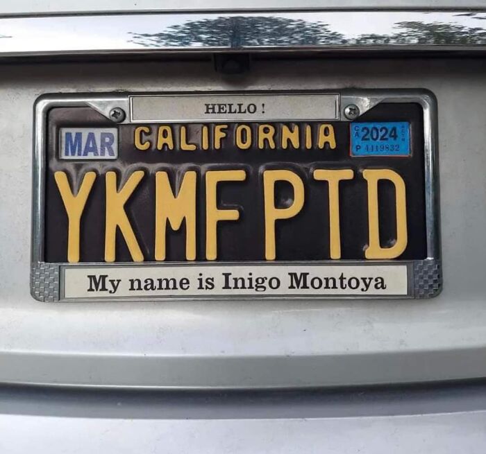 California license plate with humorous Gen X reference, "My name is Inigo Montoya" tagline.
