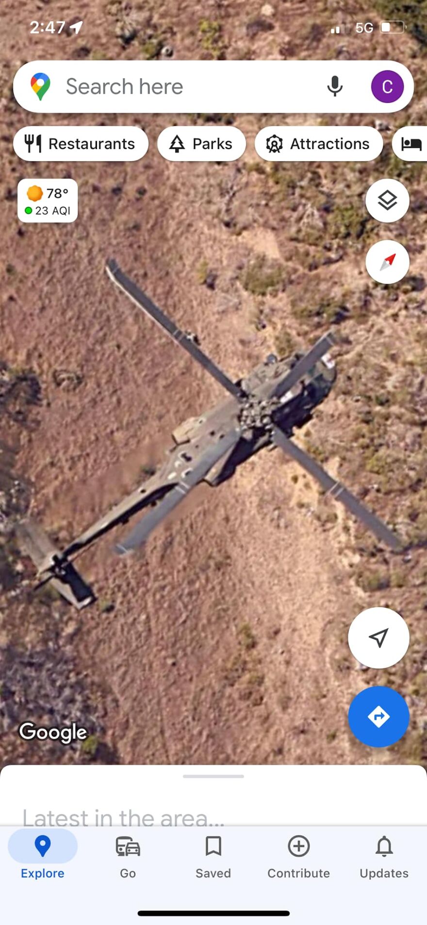 Strange thing on Google Earth: aerial view of a helicopter on a rocky terrain.