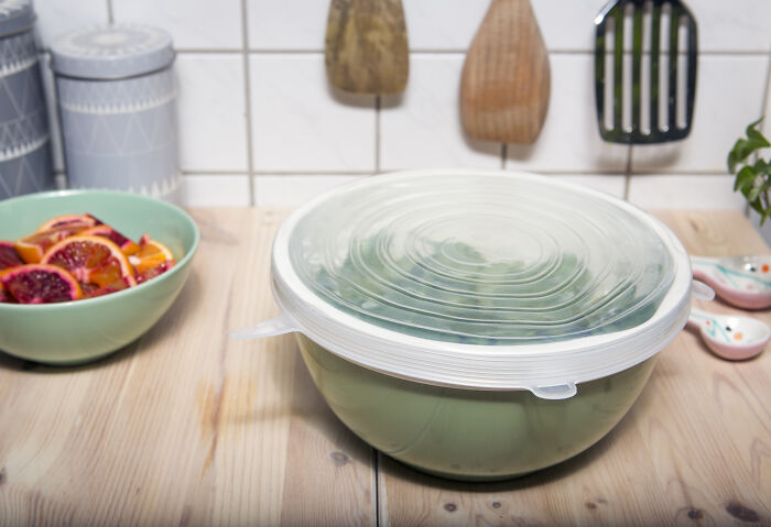 Reusable silicone food cover on a bowl, showcasing a space-saving purchase in the kitchen.
