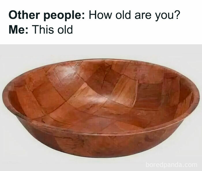 Wooden salad bowl with humorous caption about age, evoking childhood nostalgia.