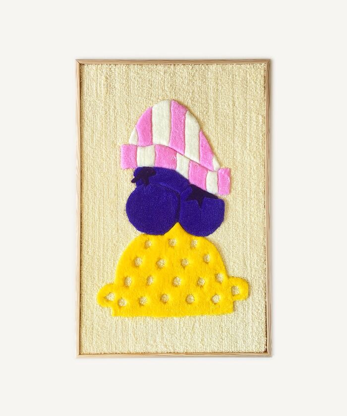 Tufted artwork featuring abstract shapes in yellow, purple, and pink by Cléa Delogu.