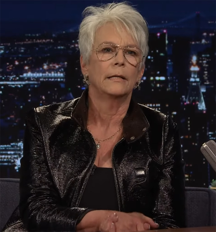 A celebrity in black jacket, sitting during a nighttime talk show, discussing issues related to LA wildfires. A celebrity in black jacket, sitting during a nighttime talk show, discussing issues related to LA wildfires.
