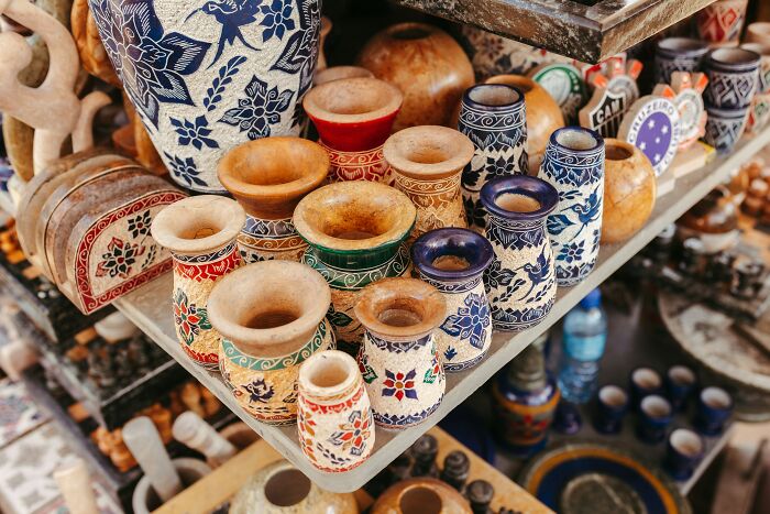Colorful pottery and wooden items on display.