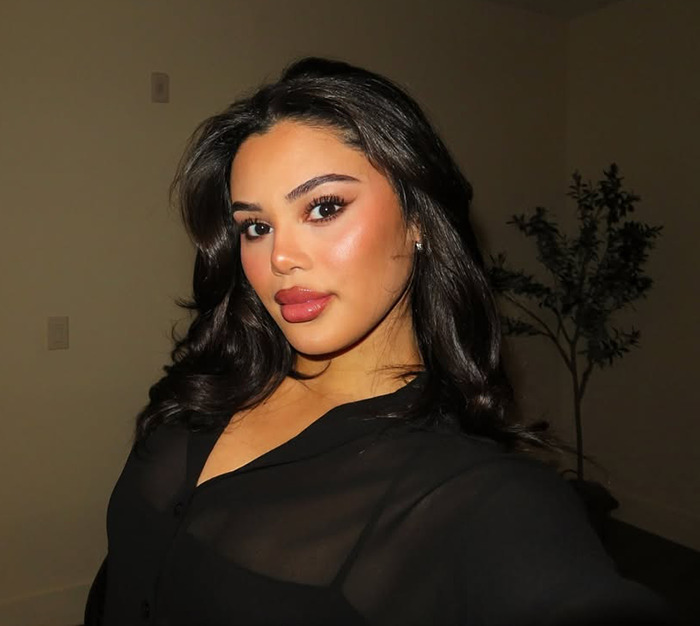 Kaya Odom posing indoors, showcasing her appearance after an Ozempic face treatment.