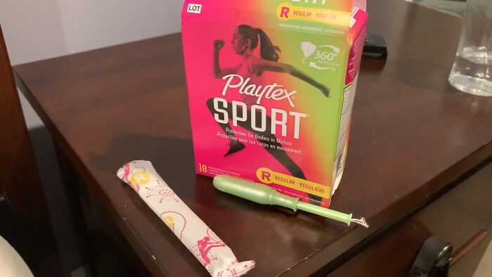 Playtex Sport tampons box on a table, illustrating false advertisement concerns.
