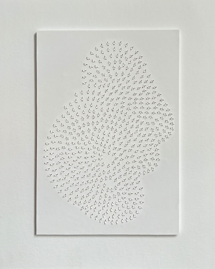 Intricate paper cut design illustrating tree-less existence with delicate patterns on white background.