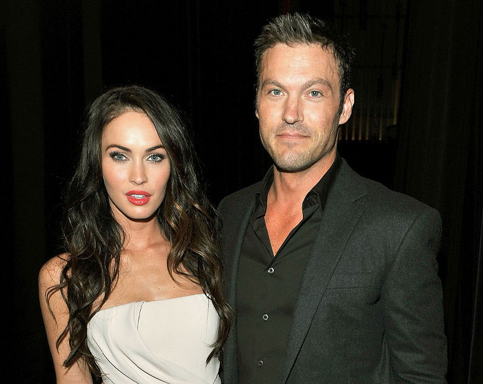 Megan Fox and Brian Austin Green posing together at an event, relating to Megan Fox kids and co-parenting challenges.