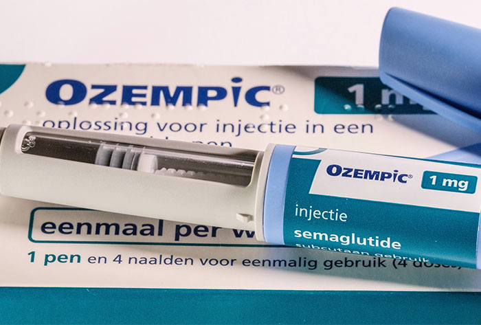 Ozempic injection pen on packaging, highlighting semaglutide medication.