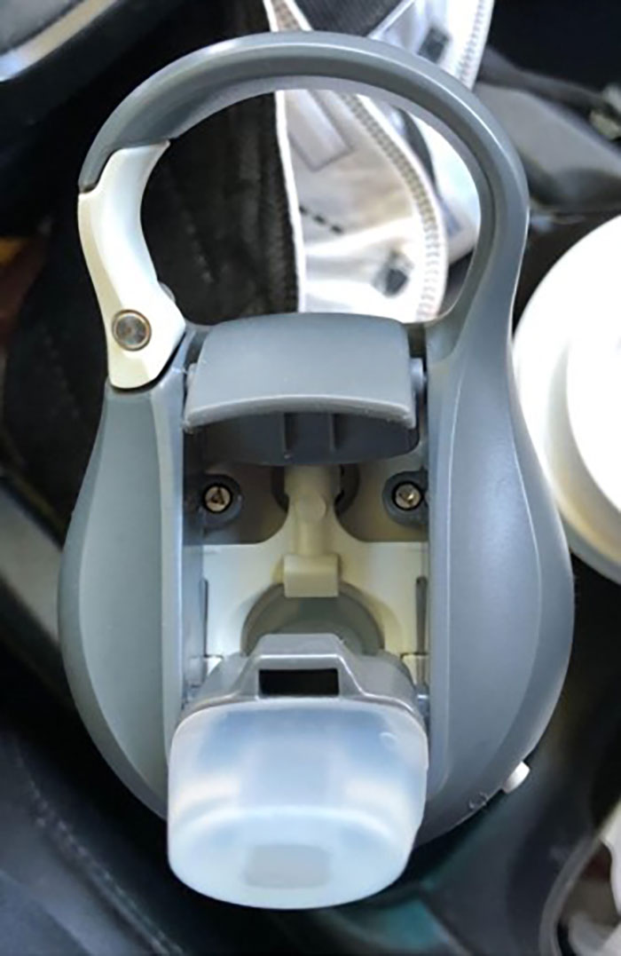 Water bottle cap resembling a face, showcasing pareidolia phenomena.