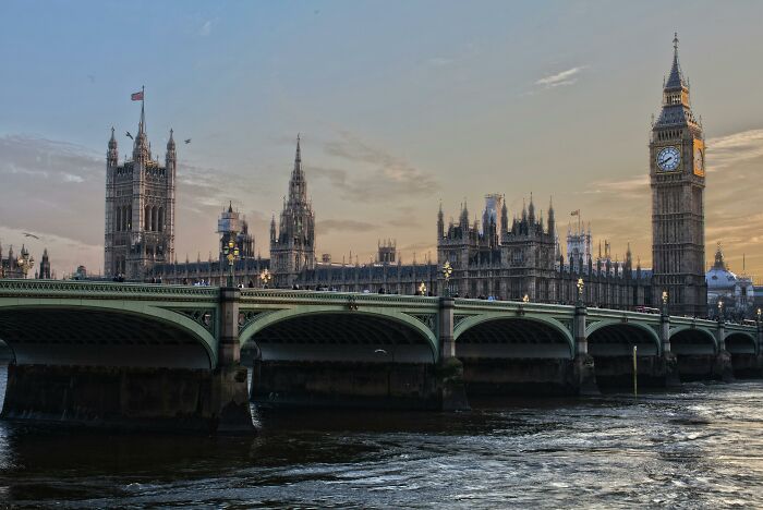 Big Ben and Westminster Bridge showcasing peculiar architectural style in London.