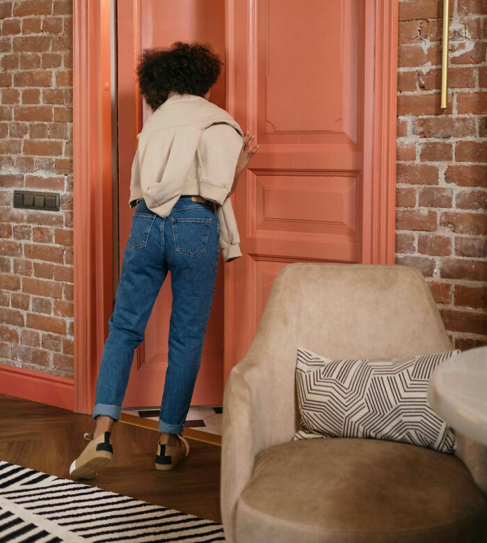 Teen entering a room, illustrating parental actions that infuriate them, creating conflict at home.