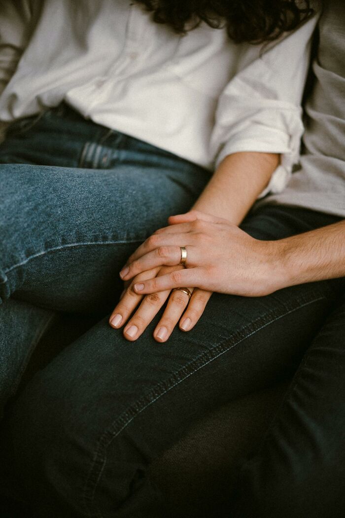Couple holding hands, showcasing intimate connection, highlighting non-s****l attraction in relationships.