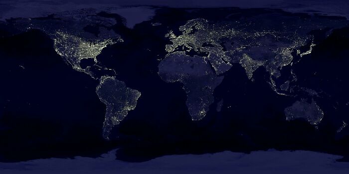 World map at night showing city lights, related to celebration days worldwide challenge.