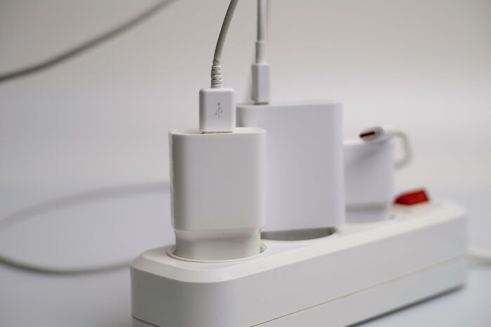 Power strip with multiple chargers plugged in, showcasing improved functionality in daily life.
