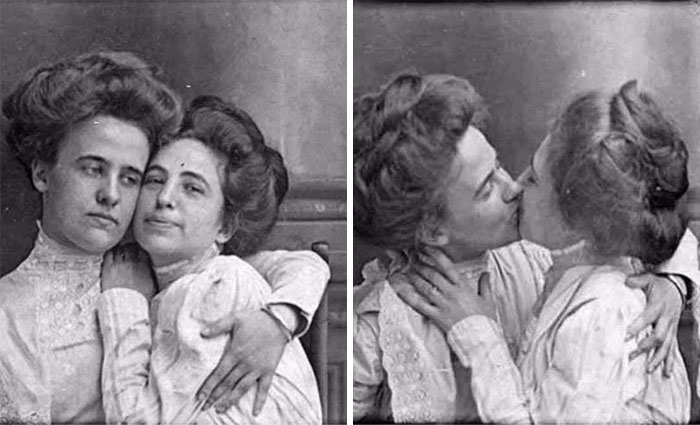 Two women from the Victorian era embracing and kissing, showcasing candid affection.