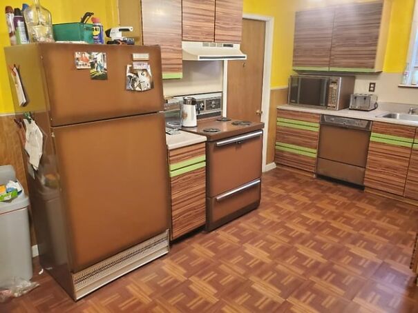 Retro kitchen with brown appliances and wood cabinets, evoking nostalgia for the good old days.