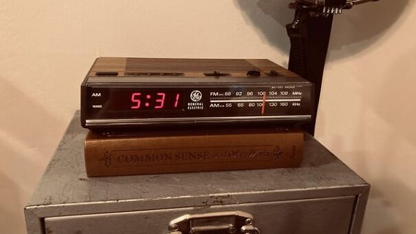 Retro alarm clock on a book titled "Common Sense," displaying 5:31 AM, recalling the good old days.
