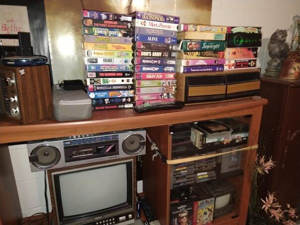 Retro finds: A vintage TV, boombox, and stacks of VHS tapes evoke nostalgia for the good old days.
