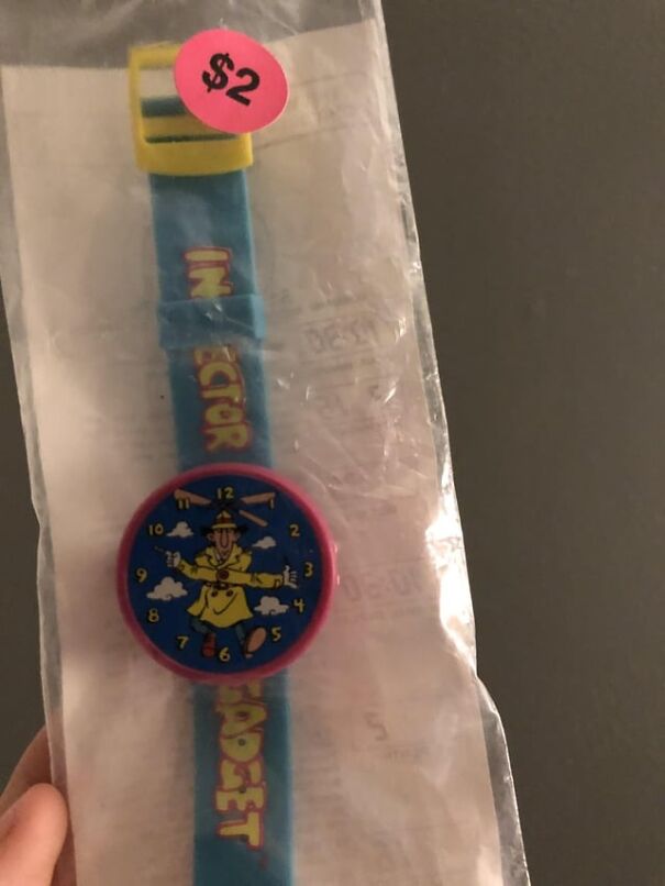 Retro wristwatch featuring a cartoon character in original packaging priced at $2, evoking nostalgic memories.