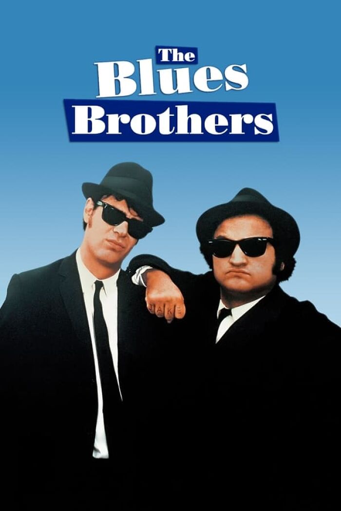 Two men in suits and sunglasses pose for a "The Blues Brothers" movie poster; a classic nostalgia film.