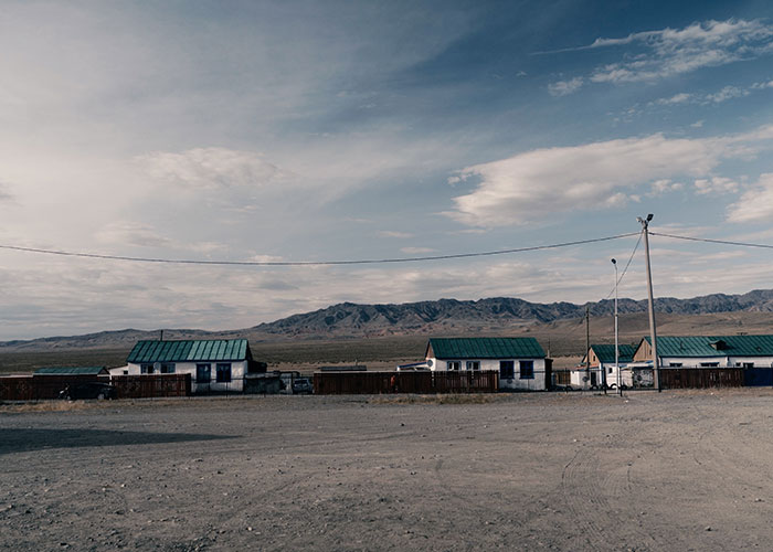 Desolate cityscape with small houses and barren land, highlighting one of the scariest cities.