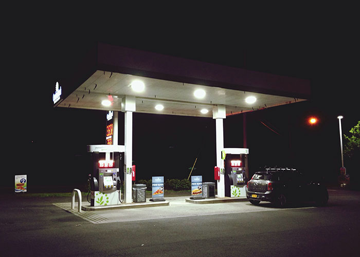 Nighttime view of a dimly lit gas station in one of the scariest cities people have visited.