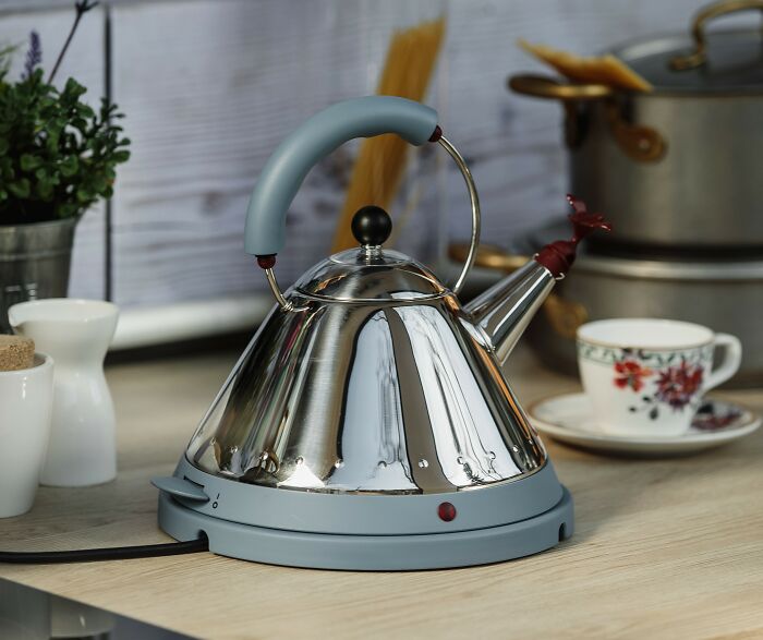 Affordable electric kettle on kitchen counter alongside a floral teacup.
