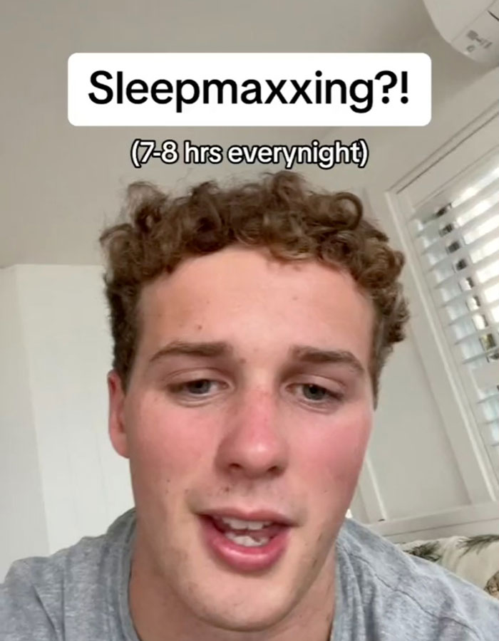Young person discussing the sleepmaxxing trend, advocating 7-8 hours of sleep nightly.