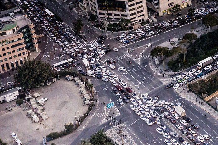 Aerial view of a busy city intersection with heavy traffic illustrating random things people did that saved them later.