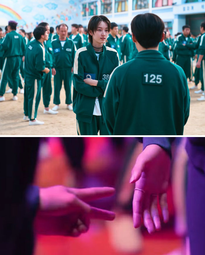 Characters in green tracksuits have a conversation while two hands play rock-paper-scissors, hinting at Squid Game 2 clues.