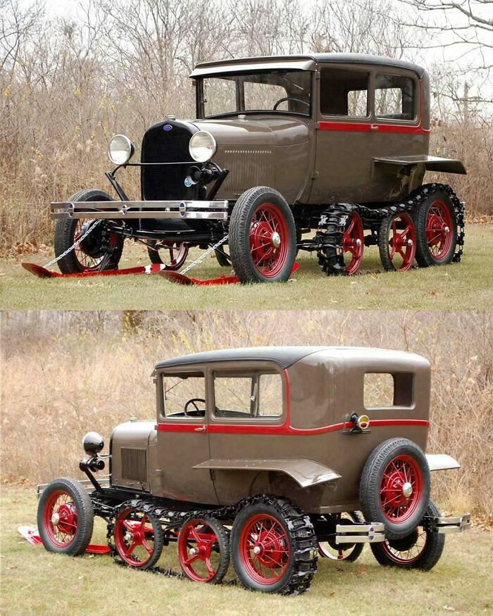 Vintage car with red spoke wheels and tracks, showcasing fascinating design against a natural backdrop.